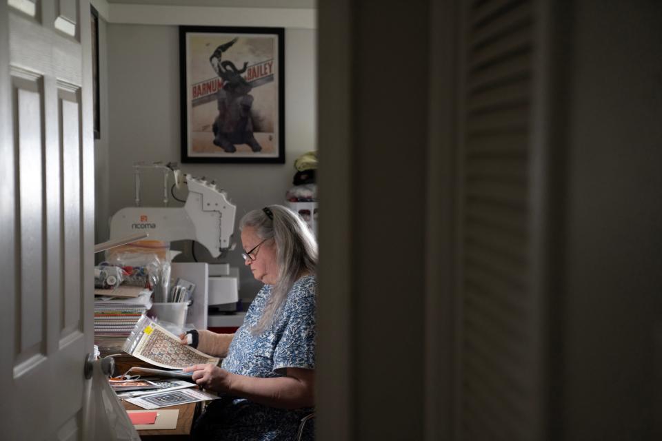 Jennifer Worley, in her sewing room in Newton. State funding allows her to pay her daughter's aides only half as much as those hired by the group-home industry, she said.