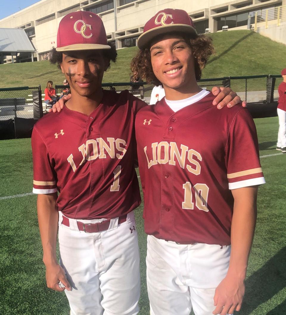 Brothers Royce Clayton Jr., left, a senior center fielder, and Elijah Clayton, a junior middle infielder, helped lead Oaks Christian to a share of the Marmonte League title while being coach by their father, Royce Sr., who played in the major leagues from 1991 to 2007.