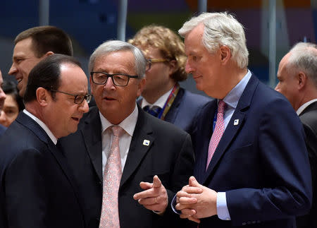 European Chief Negotiator for Brexit Michel Barnier chats with European Commission President Jean-Claude Juncker and France's President Francois Hollande during a EU summit in Brussels, Belgium April 29, 2017. Reuters/Eric Vidal