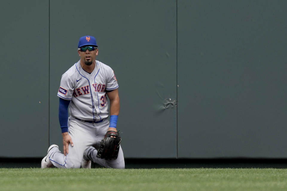 New York Mets center fielder Rafael Ortega watches after failing to catch a tw-run home run hit by Kansas City Royals' Bobby Witt Jr. during the third inning of a baseball game Thursday, Aug. 3, 2023, in Kansas City, Mo. (AP Photo/Charlie Riedel)