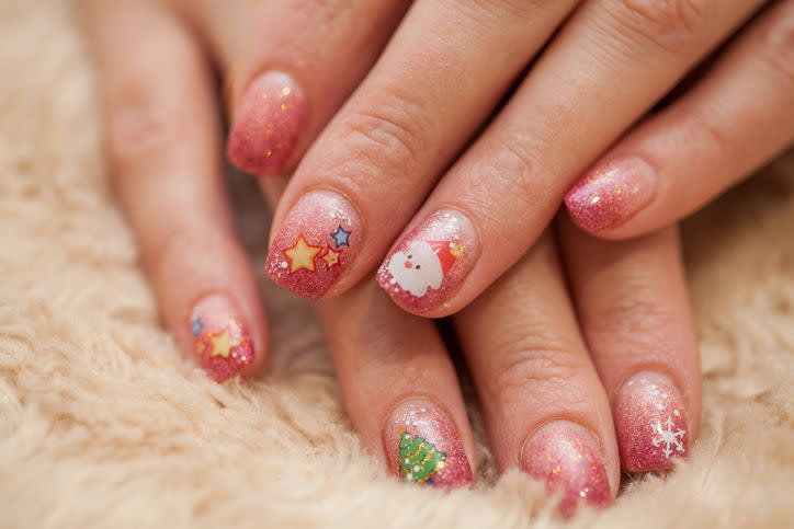 festive manicure with santas and christmas trees