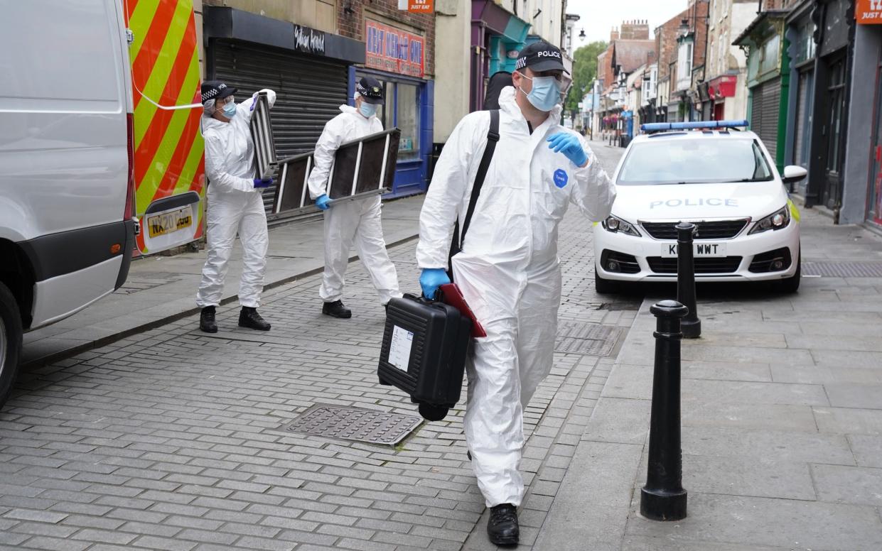 The forensic team carry equipment into the building in Fore Bondgate, Bishop Auckland