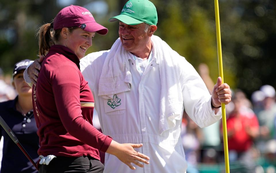 Lottie Woad celebrates with her caddie Steve Robinson