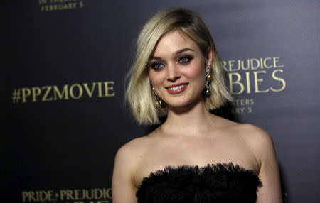 Cast member Bella Heathcote poses at the premiere of "Pride and Prejudice and Zombies" in Los Angeles, California January 21, 2016. REUTERS/Mario Anzuoni