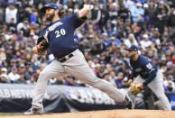 Milwaukee Brewers starting pitcher Wade Miley works against the Colorado Rockies in the first inning of Game 3 of a baseball National League Division Series, Sunday, Oct. 7, 2018, in Denver. (AP Photo/John Leyba)