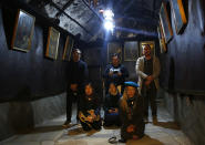 In this Wednesday, Dec. 5, 2018 photo, Christian worshipers pray inside the Grotto at the Church of the Nativity, built atop the site where Christians believe Jesus Christ was born, in the West Bank City of Bethlehem. City officials are optimistic that the renovated church will help add to a recent tourism boom and give a boost to the shrinking local Christian population. (AP Photo/Majdi Mohammed)