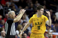 San Francisco's Remu Raitanen reacts after scoring a three-point basket during the first half of an NCAA college basketball game against Gonzaga in the West Coast Conference men's tournament Monday, March 9, 2020, in Las Vegas. (AP Photo/Isaac Brekken)
