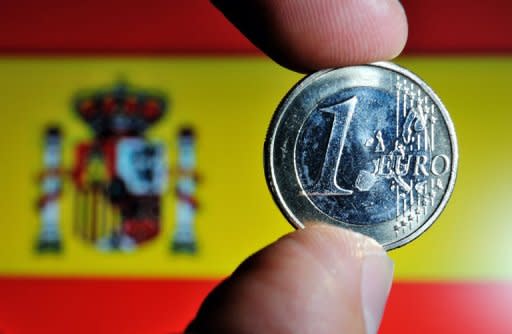 Spain's sovereign risk premium shot to a fresh euro-era record as Madrid announced new bonds to finance debt-struck regions and as banks scrambled to clean up bad loans