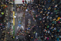 A crowd gathers next to the spot where George Floyd was murdered at George Floyd Square after a guilty verdict was announced at the trial of former Minneapolis police Officer Derek Chauvin for the 2020 death of Floyd, Tuesday, April 20, 2021, in Minneapolis. Former Minneapolis police Officer Derek Chauvin has been convicted of murder and manslaughter in the death of Floyd. (AP Photo/Julio Cortez)