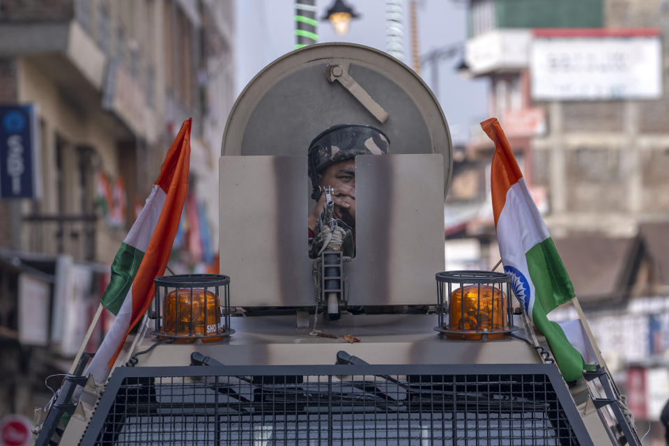An Indian paramilitary soldier stands guard atop an armored vehicle on India's Independence Day in Srinagar, Indian controlled Kashmir, Tuesday, Aug. 15, 2023. Security has been beefed up in the region around the venues of India's Independence Day celebrations. (AP Photo/Dar Yasin)