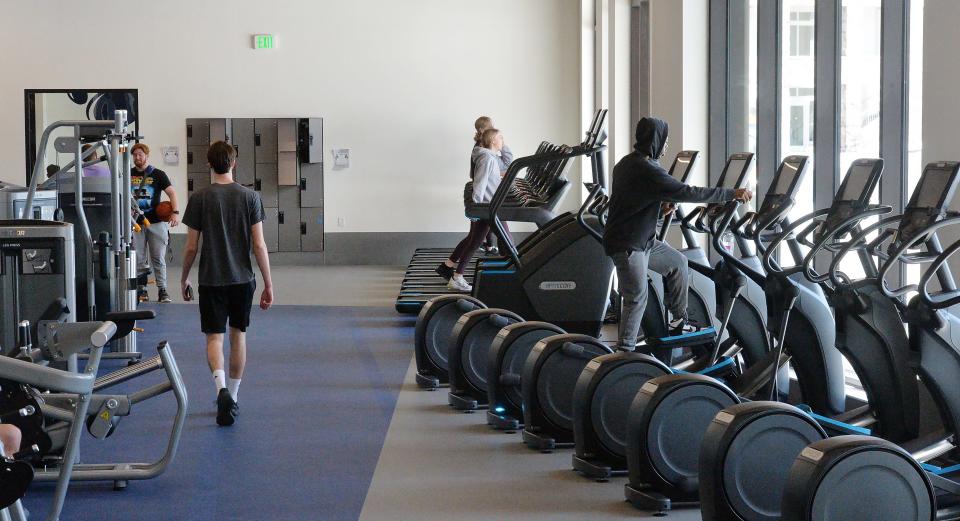 Penn State Behrend students exercise inside the new Erie Hall.