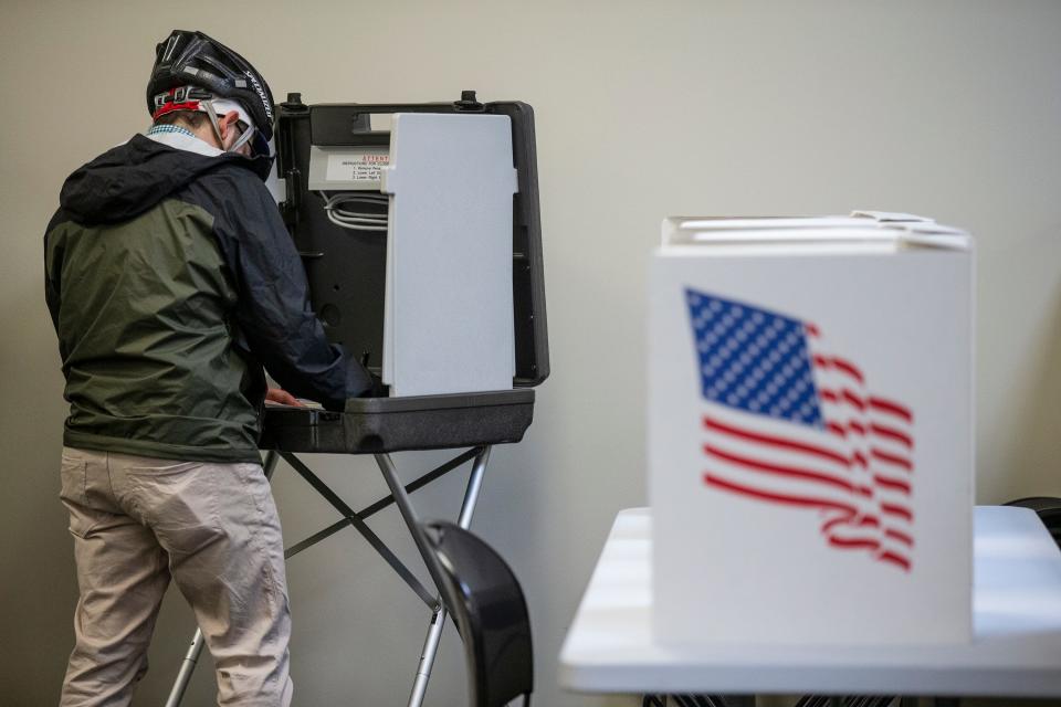 Michael DuPré, of Des Moines, fills out his ballot and casts his vote early, on Tuesday, May 24, 2022, at the Polk County Election Office, in Des Moines. 