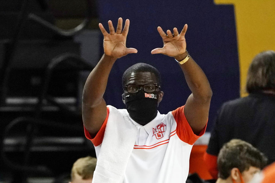 Bowling Green head coach Michael Huger signals from the sideline during the first half of an NCAA college basketball game against Michigan, Wednesday, Nov. 25, 2020, in Ann Arbor, Mich. (AP Photo/Carlos Osorio)