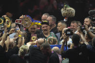 Ukraine's Oleksandr Usyk celebrates after beating Britain's Tyson Fury in their undisputed heavyweight world championship boxing fight at the Kingdom Arena in Riyadh, Saudi Arabia, Sunday, May 19, 2024. (AP Photo/Francisco Seco)