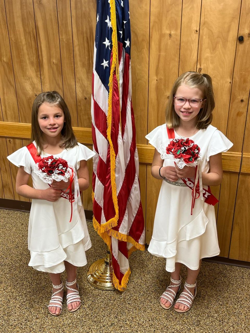 Representing Harry Higgins Post 88 of the American Legion are Little Miss Poppy Abigail Valentine, 6, and Miss Poppy Rosemary Valentine, 9.