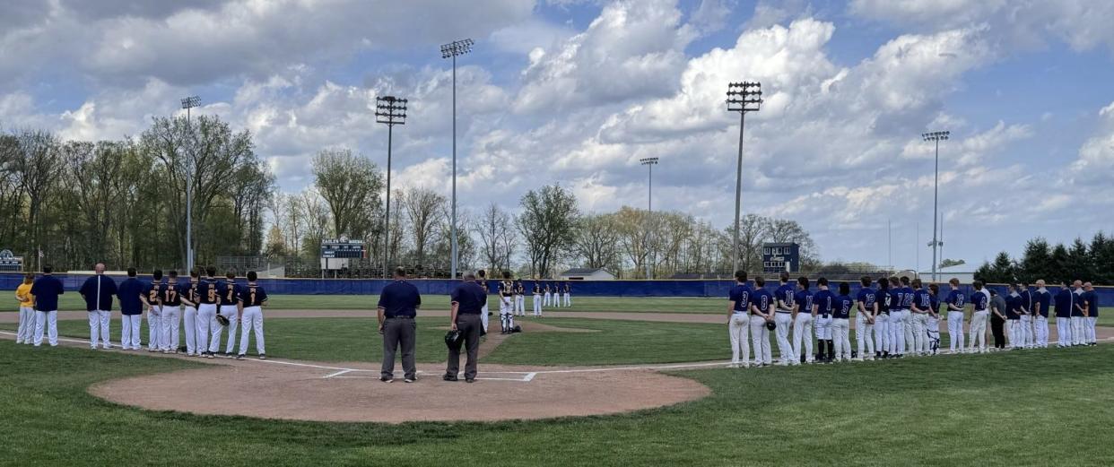 Whiteford and Erie Mason line up for the national anthem before a baseball doubleheader on Wednesday, May 1, 2024.