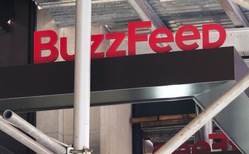 FILE - The entrance to BuzzFeed in New York is seen on Nov. 19, 2020. Pulitzer prize winning digital media company BuzzFeed is cutting about 15% of its staff, according to multiple media reports. In a memo sent to staff, co-founder and CEO Jonah Peretti said that the New York company was going to start the process of shutting down its news division, and that cuts would also occur across its business, content, tech and administrative teams. (AP Photo/Ted Shaffrey, File)