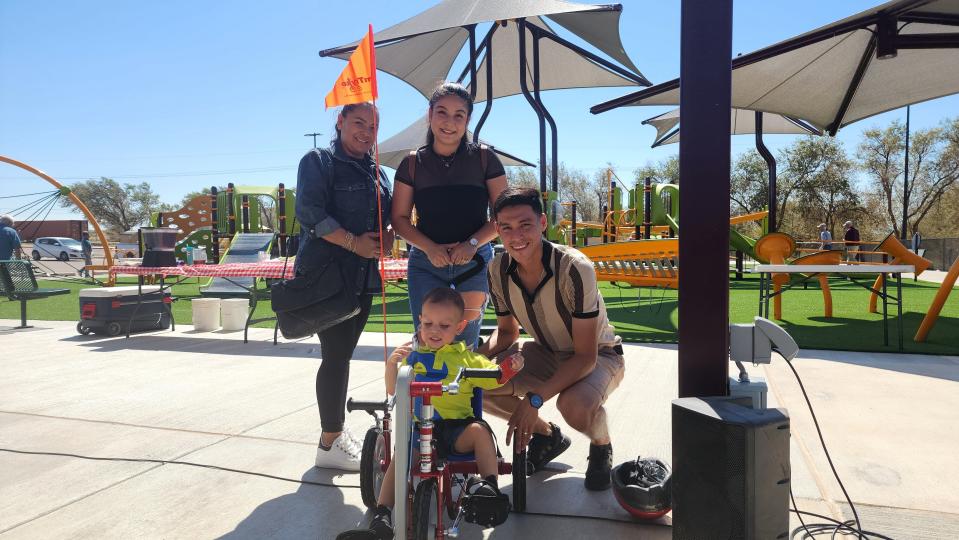 The Cisneros family with Christian and his new AMtryke Thursday at the newly built Kylie Hiner Memorial Park in Canyon.