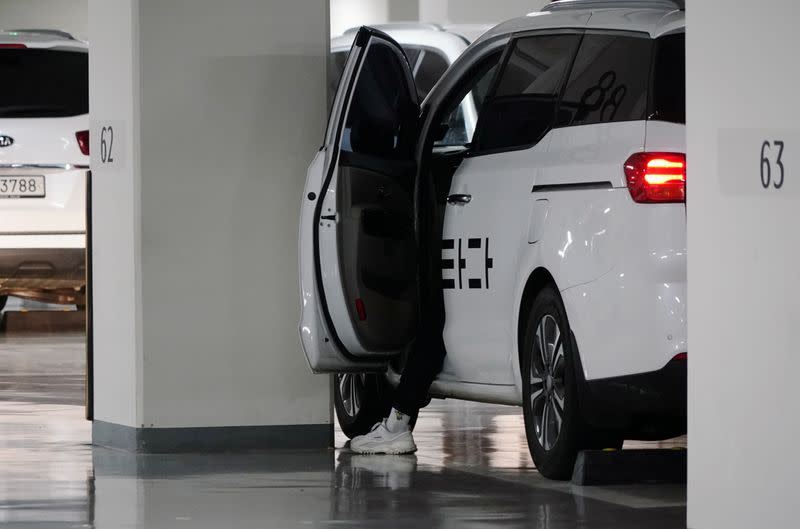 A driver gets out of a vehicle of ride-hailing service operator Tada at its garage in Seoul