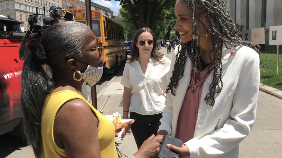Maya Wiley speaks to a voter outside the Brooklyn Central Library on Tuesday, June 15. The voter, who gave her name only as Dee, said she is going to vote for either Wiley or Eric Adams. She said she does not want the next mayor to defund the police but does want the police department to be reformed. (Jon Ward/Yahoo News)