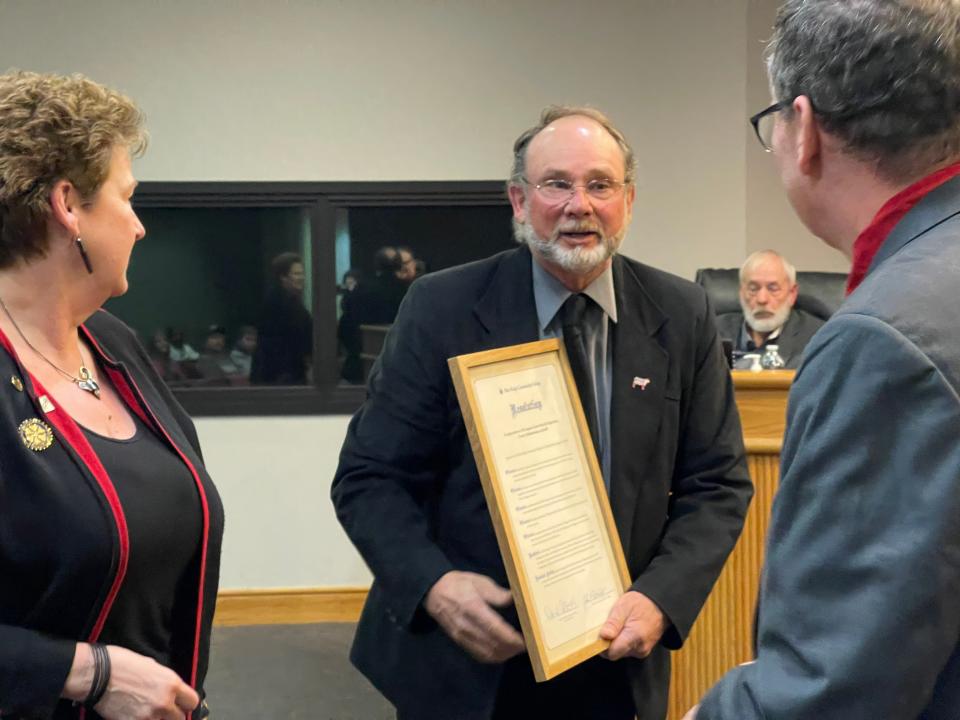 Chair Jeffrey Slaven accepts the Blue Ridge Community College resolution.