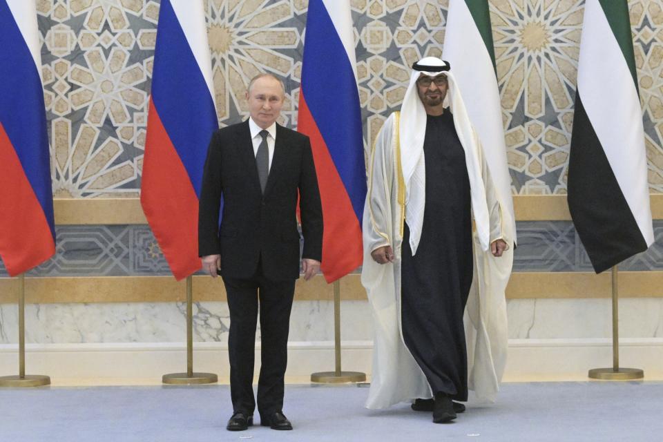 Emirati President Sheikh Mohammed bin Zayed Al Nahyan, right, and Russian President Vladimir Putin pose for a photo prior to their talks at Qasr Al Watan, Abu Dhabi, United Arab Emirates, Wednesday, Dec. 6, 2023. (Alexei Nikolsky, Sputnik, Kremlin Pool Photo via AP)