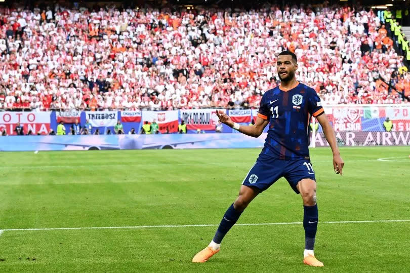 Cody Gakpo celebrates scoring a goal for the Netherlands against Poland at Euro 2024