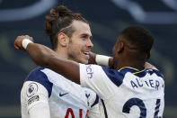 Tottenham's Gareth Bale, centre, celebrates with Tottenham's Serge Aurier after scoring his side's fourth goal during an English Premier League soccer match between Tottenham Hotspur and Burnley at the Tottenham Hotspur Stadium in London, England, Sunday, Feb. 28. 2021. (Matthew Childs/Pool via AP)