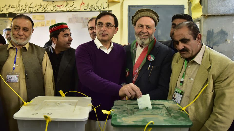 Pakistan Tehreek-e-Insaaf party's chairman Gohar Ali Khan (C) casts his ballot to vote at a polling station during Pakistan's national elections in Buner on February 8, 2024. - Hasham Ahmed/AFP/Getty Images
