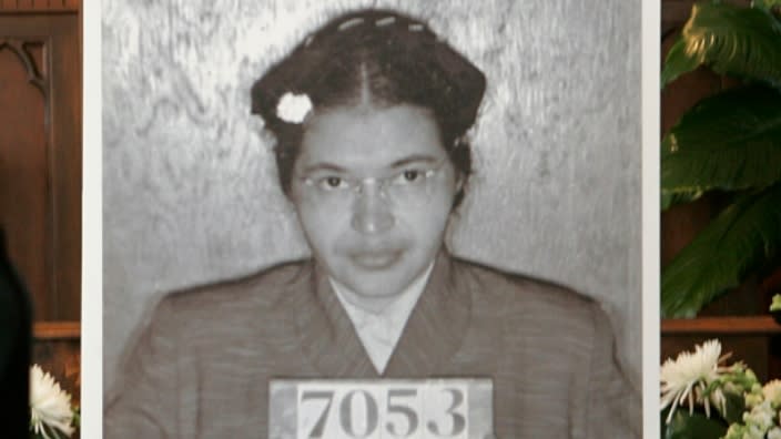 A copy of Rosa Parks’ photo from her 1955 arrest in Montgomery, Alabama, is shown during a memorial service for the civil rights icon in 2005. She was arrested for refusing to yield her seat to a white passenger and move to the back of the bus. Rep. George Santos, R-N.Y., seems to think he was treated similarly. (Photo by Justin Sullivan/Getty Images)