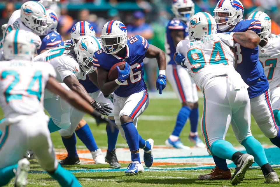 Sep 19, 2021; Miami Gardens, Florida, USA; Buffalo Bills running back Devin Singletary (26) runs with the football during the first quarter of the game against the Miami Dolphins at Hard Rock Stadium. Mandatory Credit: Sam Navarro-USA TODAY Sports
