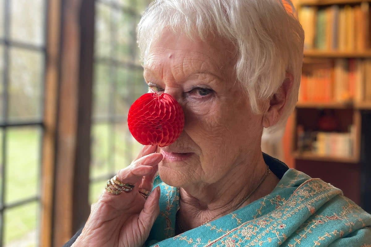 Dame Judi Dench wears the new nose to support Red Nose Day 2023 (Comic Relief/PA)