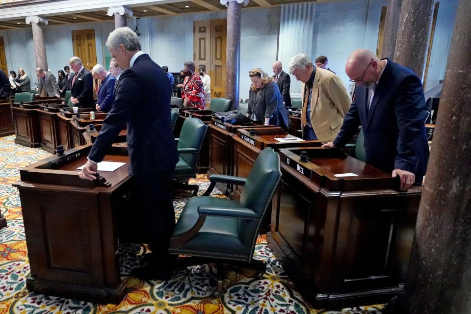 Members of the Tennessee Senate stand for a prayer on Oct. 27, 2021, in Nashville. The state legislature was meeting for a special session to address COVID-19 measures after Gov. Bill Lee declined to do so.