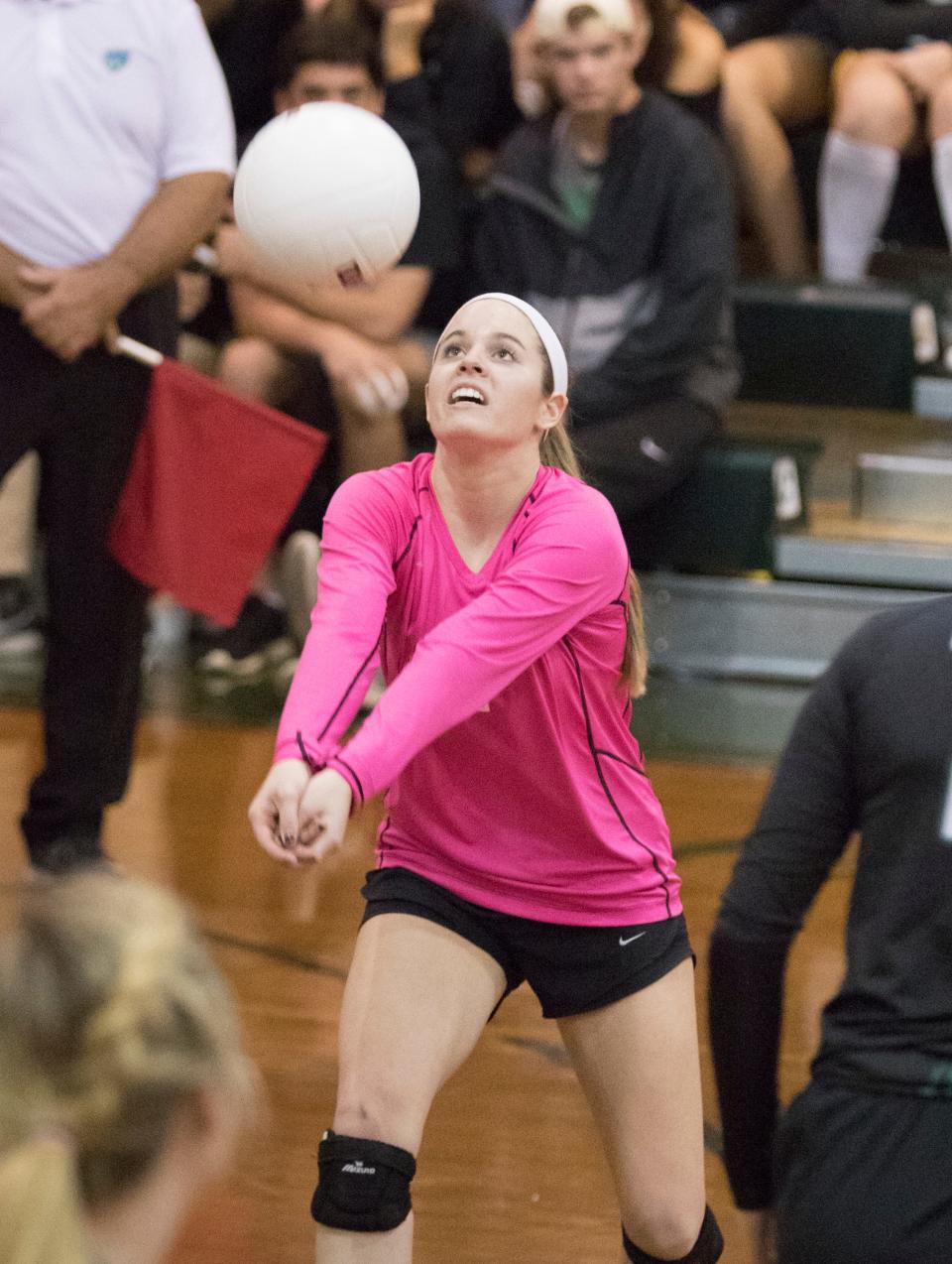 Kayla Carrell (1) hits the ball during the volleyball match against Bolles at Catholic High School in Pensacola on Tuesday, November 1, 2016.