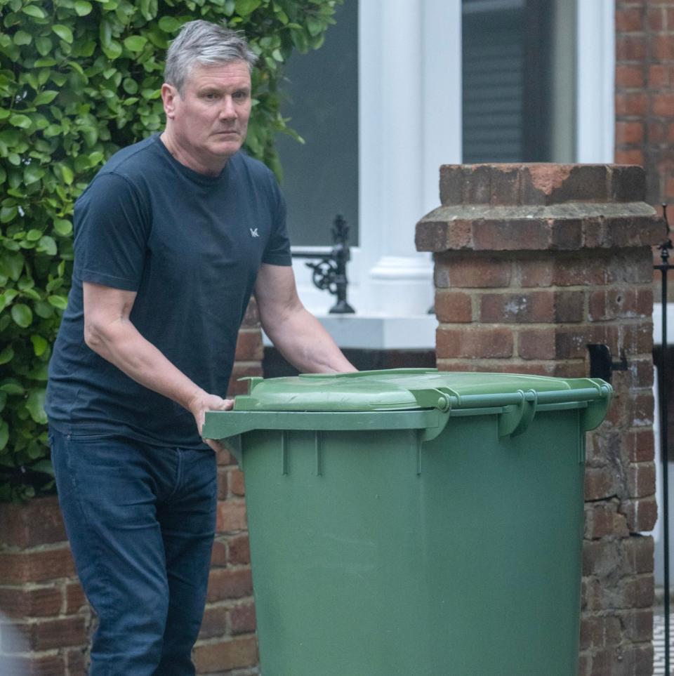 Sir Keir Starmer, the Labour leader, is pictured this morning putting his bins out ahead of PMQs at noon