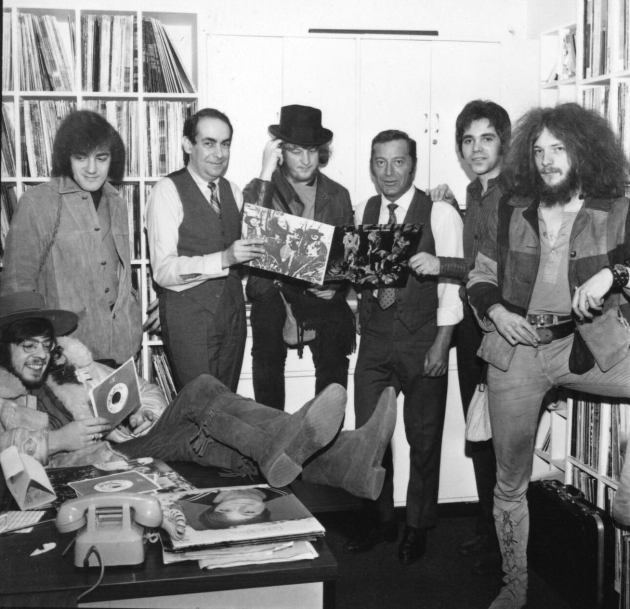 Jethro Tull pose with their album ‘This Was’ and record label executives in 1968 in New York. (Credit: PoPsie Randolph/Michael Ochs Archives/Getty Images)