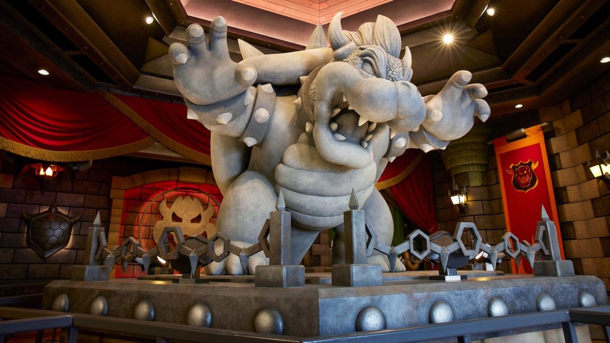  Bowser statue in MarioKart attraction queue 