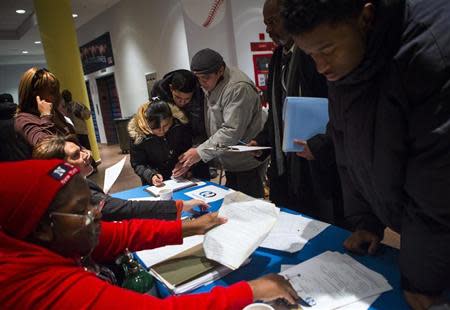 People attend a job training and resource fair at Coney Island in New York December 11, 2013. REUTERS/Eric Thayer