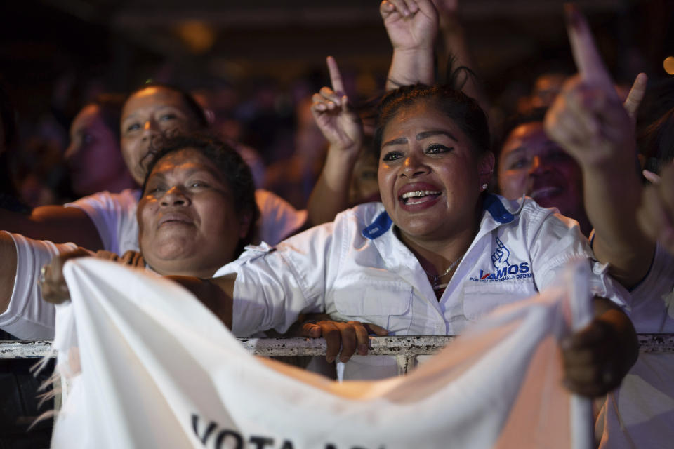 Supporters of Alejandro Giammatei, presidential candidate with the Vamos party, cheer after partial results were announced in Guatemala City, Sunday, Aug. 11, 2019. Giammattei headed for a victory in Sunday’s presidential runoff election, garnering favor with voters for his get-tough approach on crime and socially conservative values. (AP Photo/Santiago Billy)