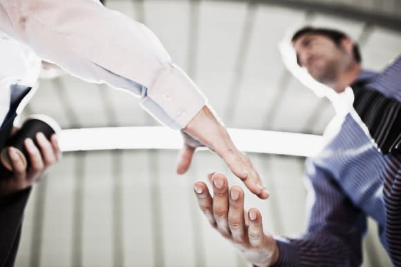 Two businessmen shaking hands.