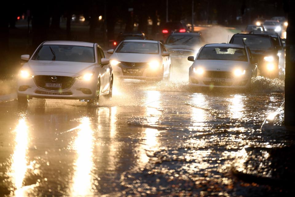 Heavy rain at Brighton-Le-Sands south of the airport on Tuesday. Source: AAP