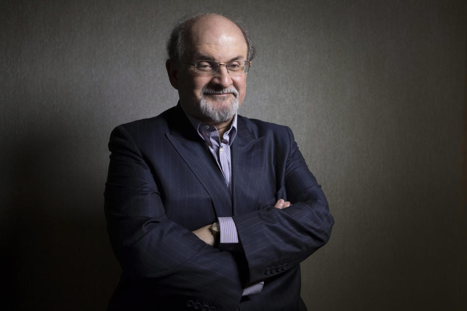 FILE - This Sept. 8, 2012 file photo shows author Salman Rushdie posing during the 2012 Toronto International Film Festival in Toronto. Rushdie is promoting the film adaptation of his breakthrough novel, "Midnight's Children," winner of the Booker Prize in 1981 and one of the most highly praised works of fiction of its time. (AP Photo/The Canadian Presss, Chris Young, file)