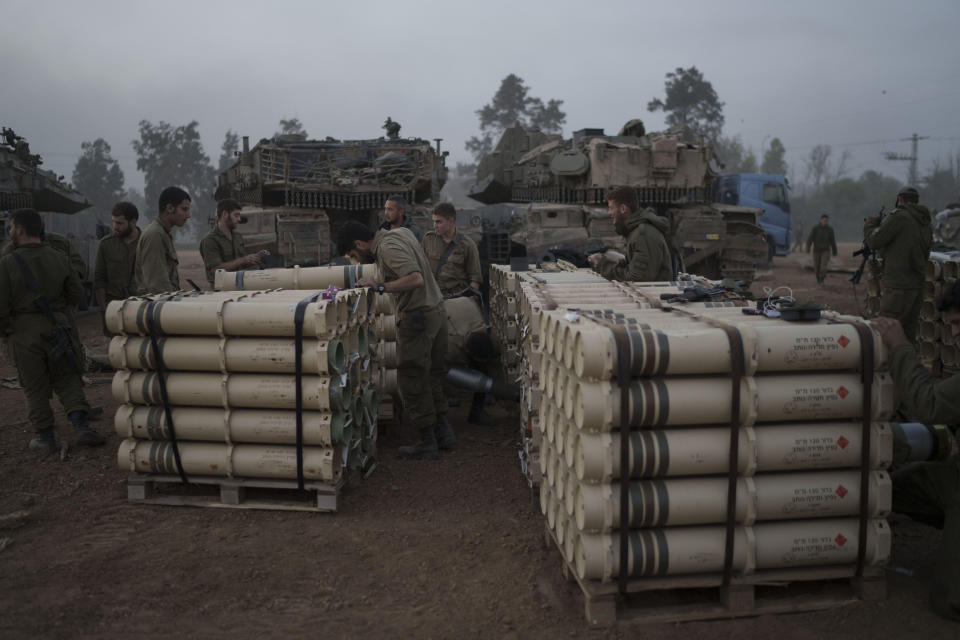 Israeli soldiers from the artillery unit store tank shells in a staging area at the Israeli-Gaza border in southern Israel, Monday, Jan. 1, 2024. The army is battling Palestinian militants across Gaza in the war ignited by Hamas' Oct. 7 attack into Israel. (AP Photo/Leo Correa)