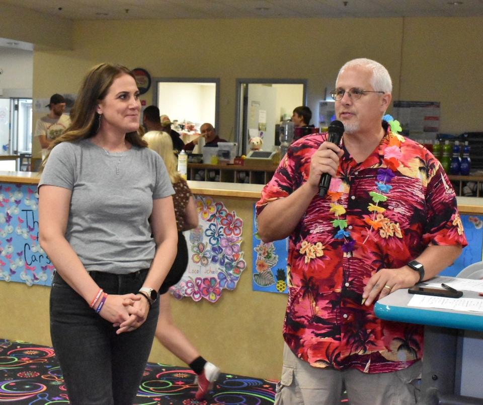 Heath principal Kat Fields and WNKO/WHTH news director Dave Doney talk during the recent Big Brothers Big Sisters Bowl for Kids at Park Lanes.