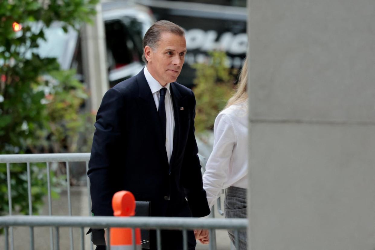 Hunter Biden, son of U.S. President Joe Biden, walks outside the federal court as his trial on criminal gun charges continues in Wilmington, Del., on Tuesday. (Hannah Beier/Reuters - image credit)