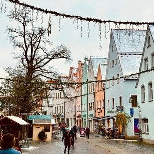 A cobblestone street and buildings in the city of Weiden, Germany, in December 2023