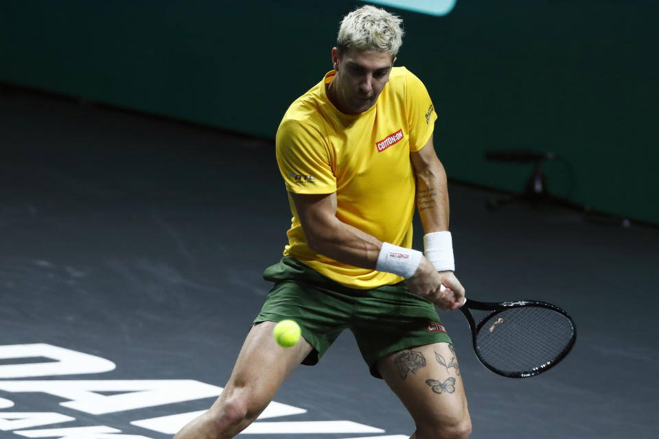 Australia's Thanasi Kokkinakis returns the ball to Canada's Denis Shapovalov during the final Davis Cup tennis match between Australia and Canada in Malaga, Spain, Sunday, Nov. 27, 2022. (AP Photo/Joan Monfort)