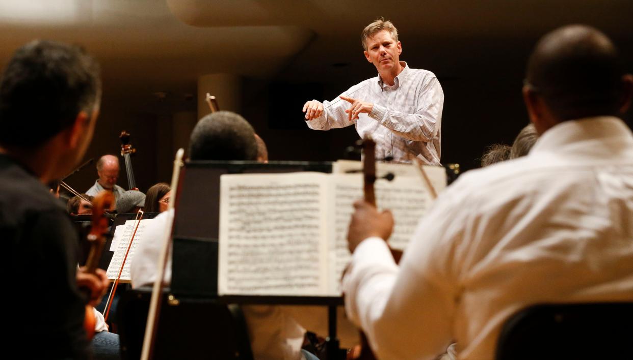 Director Adam Flatt gives instructions during rehearsal for the Tuscaloosa Symphony Orchestra Sunday, Sept. 16, 2018 in Moody Music Hall at the University of Alabama. [Staff Photo/Gary Cosby Jr.]