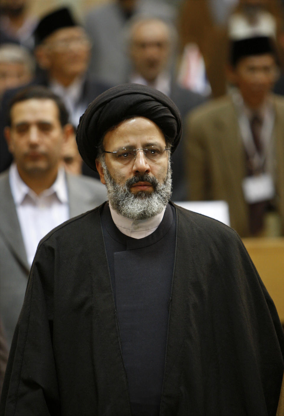 In this April 22, 2009 photo, Ebrahim Raisi attends a meeting of top prosecutors from Islamic countries, in Tehran, Iran. Iran's official IRNA news agency reported Sunday April 9, 2017, that Raisi, a hard-line cleric and close ally of Iran's supreme leader, has announced he will run in the May presidential election. (AP Photo/Vahid Salemi)