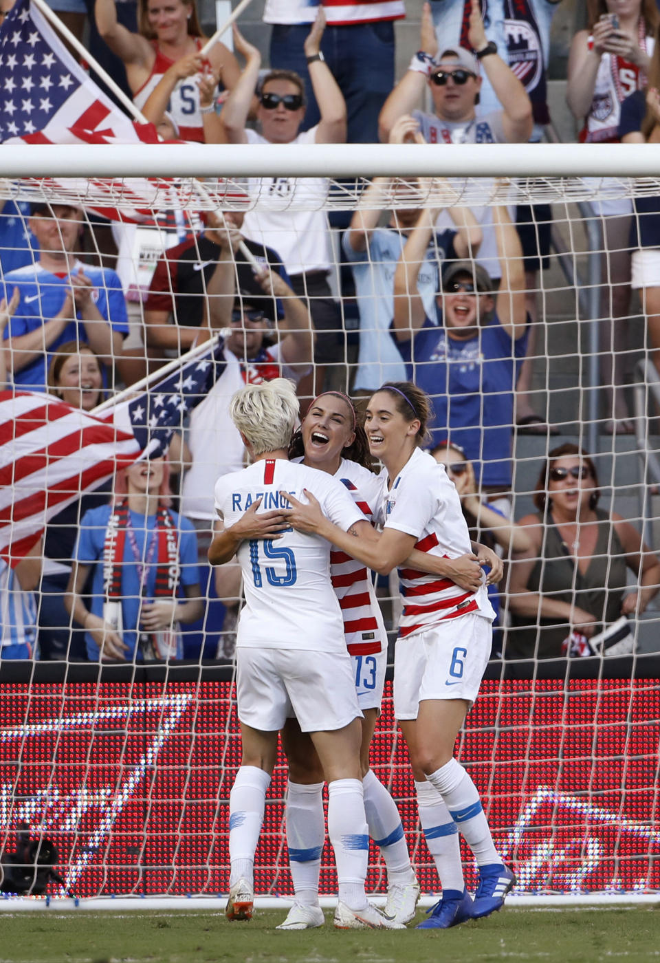 United States' Megan Rapinoe (15) and Morgan Brian (6) congratulates Alex Morgan (13) after she scored against Japan in the first half of a Tournament of Nations soccer match in Kansas City, Kan., Thursday, July 26, 2018. (AP Photo/Colin E. Braley)